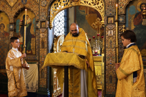 Solemn Service Beneath the Gilded Iconostasis
